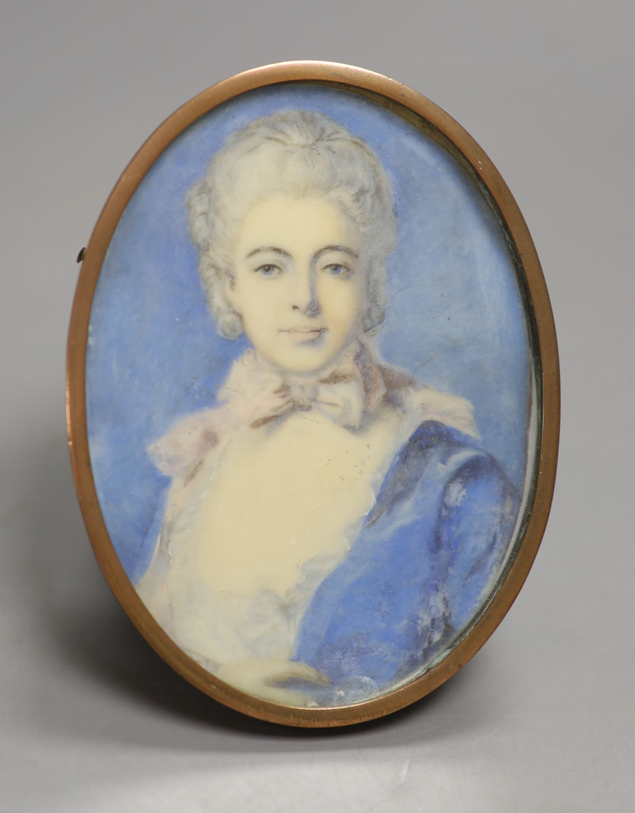 English School (early 19th century), watercolour on ivory, miniature portrait of a young lady with a bow at her neck, height 10cm